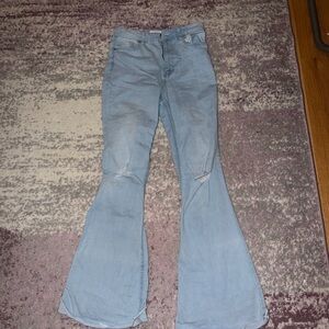 Mystique boutique Light Blue Flared Women's Jeans rips on the knees